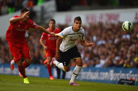 Lamela is held back by Lovren